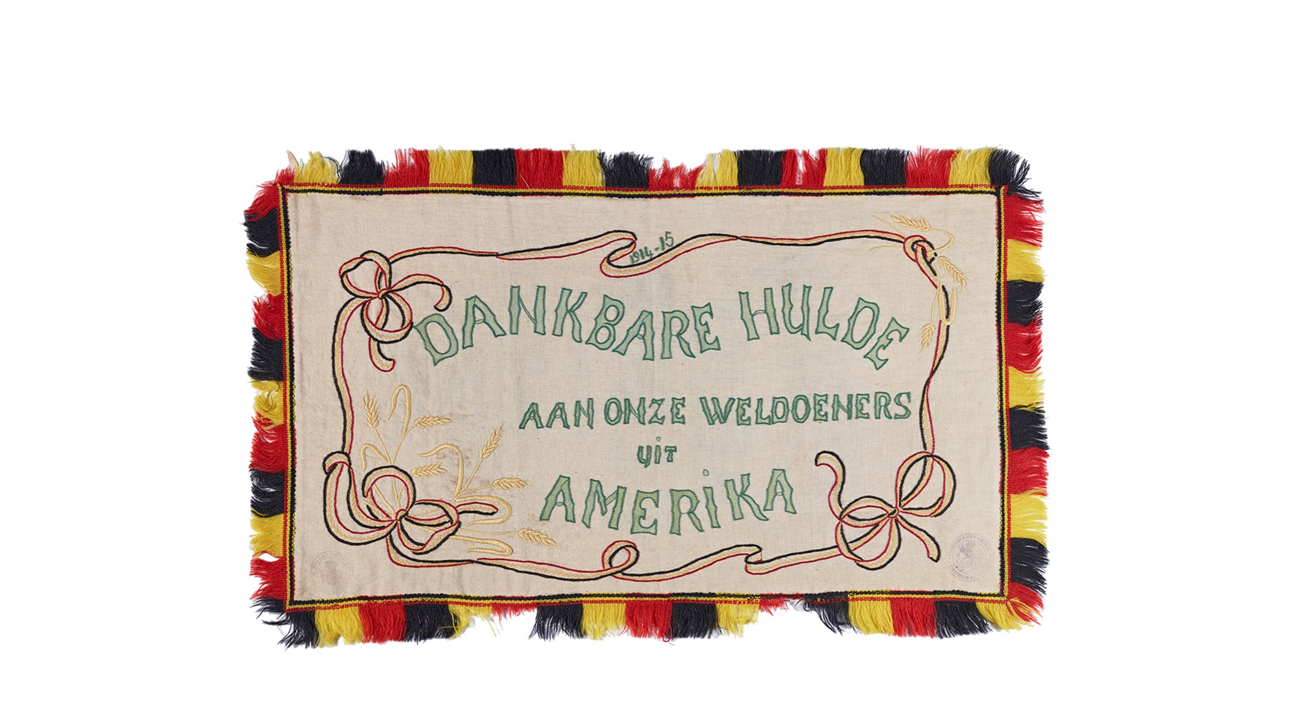 Photo of An embroidered Belgian flour sack given to Herbert Hoover in thanks for his role in the CRB. From the Herbert Hoover Subject Collection, at the Hoover Institution Archives