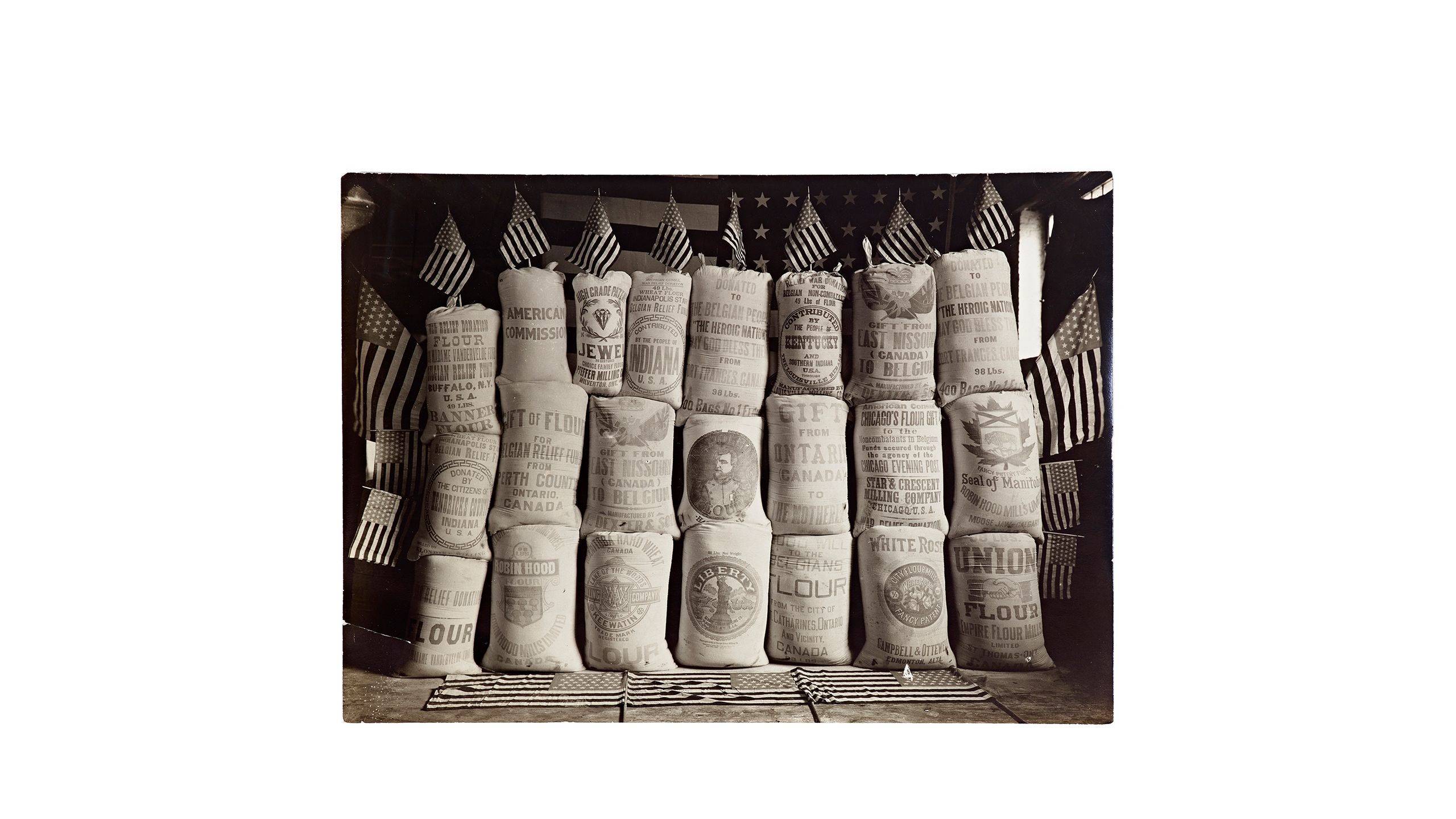 Photo of stacked American relief flour sacks in Belgium, circa 1915. From the Commission for Relief in Belgium Records (1914-1930), at the Hoover Institution Archives