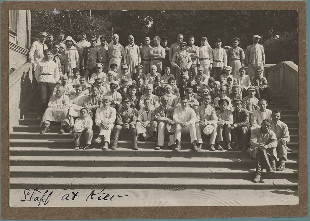 Photograph of ARA staff at Kiev outside and seated on a wide staircase, 1923