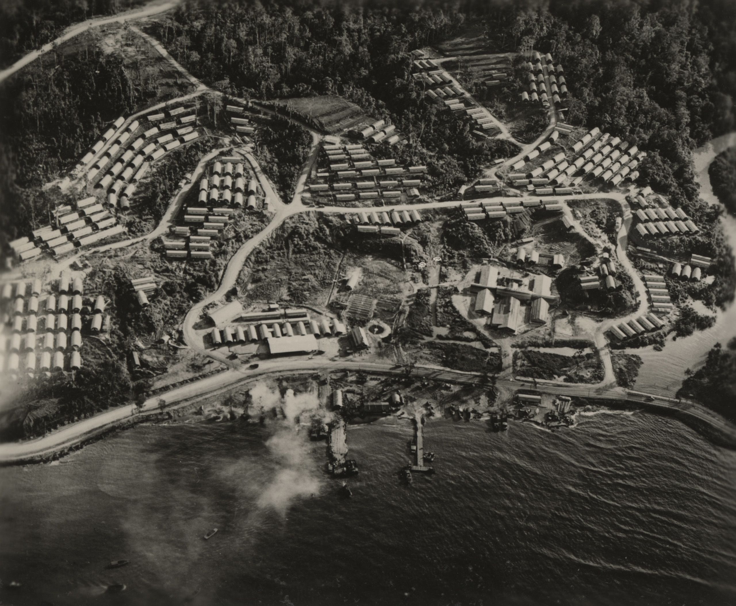 Naval Air Base Receiving Station on Manus Island, 1944. The 78th Construction Battalion built a Naval Air Base Receiving Station consisted of a mess hall and galley that could serve 10,000 men, a chapel, a theater, a library, showers and latrines, gasoline and water storage tanks, roads and docks, and 300 Quonset huts that could house 20 men each.