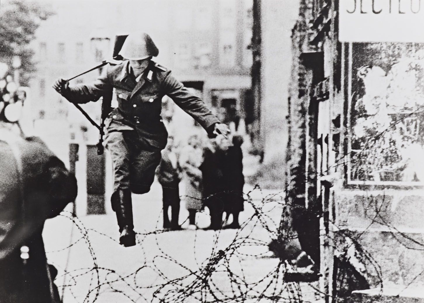 The Leap into Freedom photograph taken by Peter Leibing from August 1961. From the Berlin: Checkpoint Charlie, 1946-1989: Photographic Portfolio, ca. 1990, Hoover Institution Archives.