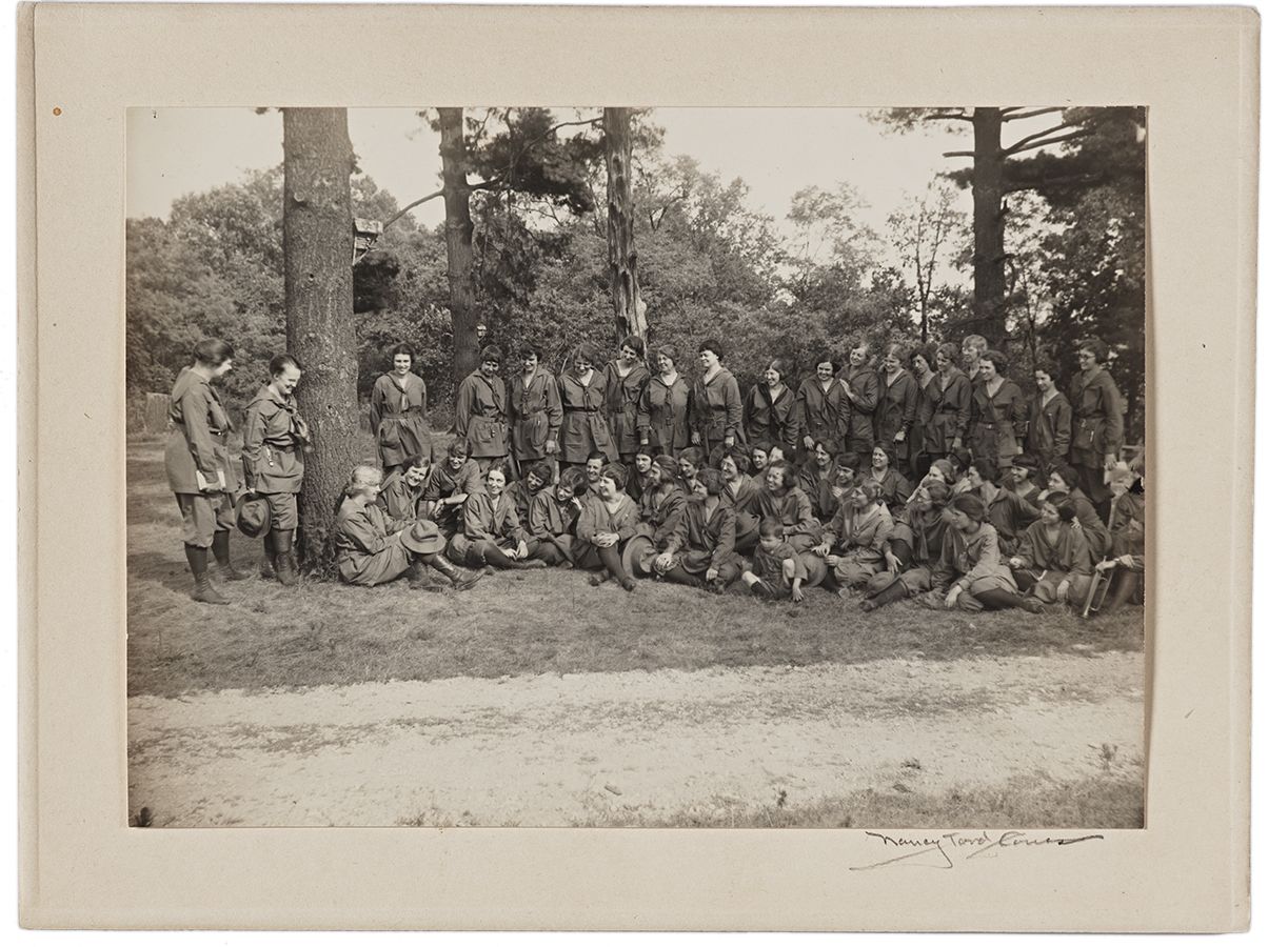 Photograph of Lou Henry Hoover (seated in front of tree) with Girl Scout troop, Camp Procter, Ohio, by Nancy Ford Cones, July 28, 1922. From the American Pictorial Collection, at the Hoover Institution Archives