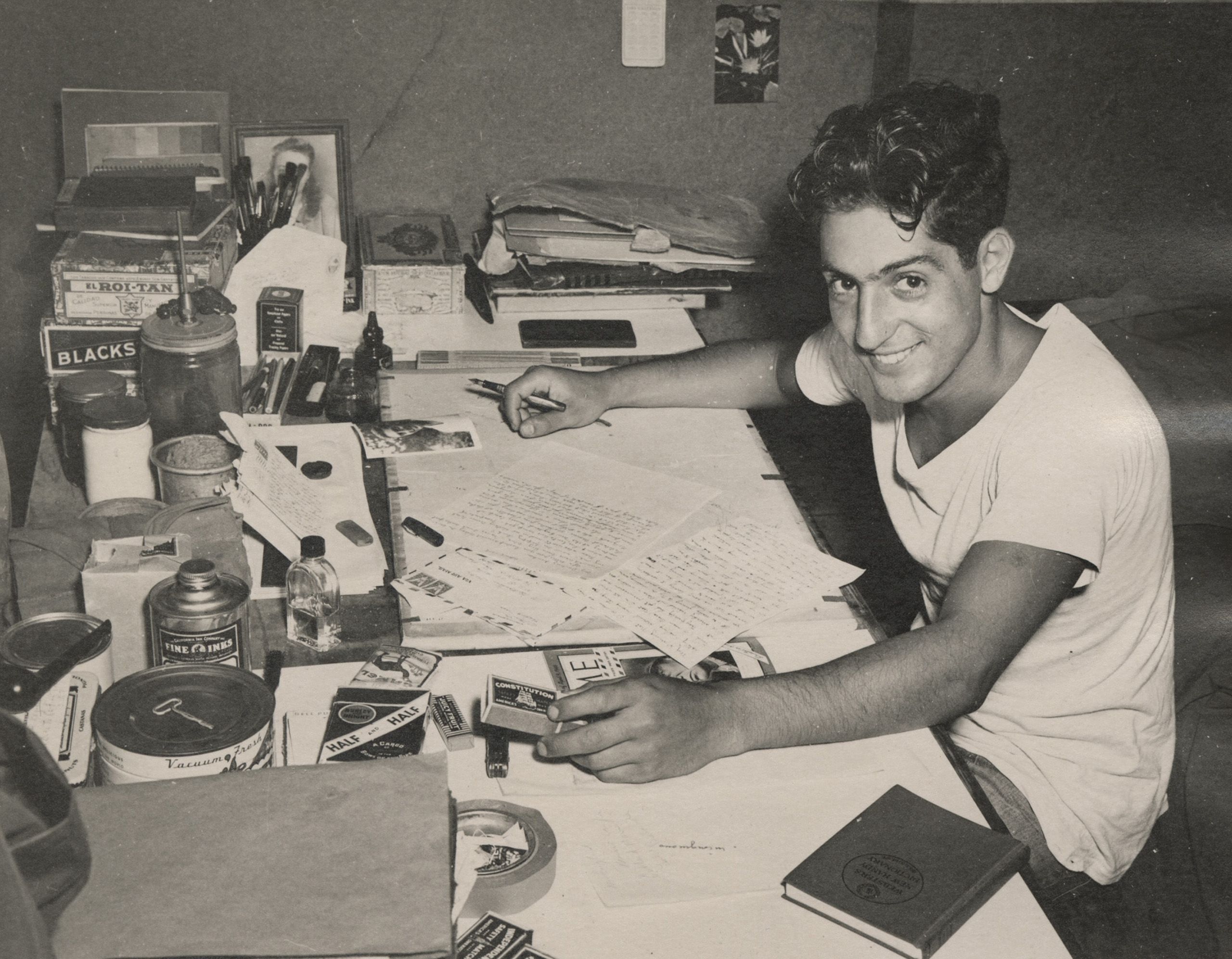 My table— didn't give me chance to tidy up! New Caledonia [Note on back], circa 1945.