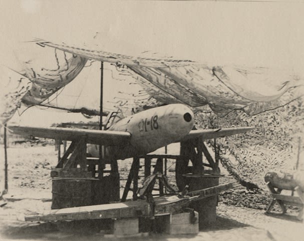 Black and white photograph of a captured Japanese Yokosuka MXY7 Ohka, No. I-18, 1945. 