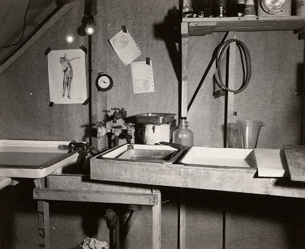 Black and white photograph of the photograph development baths set up in the 78th's darkroom at New Caledonia, 1945.