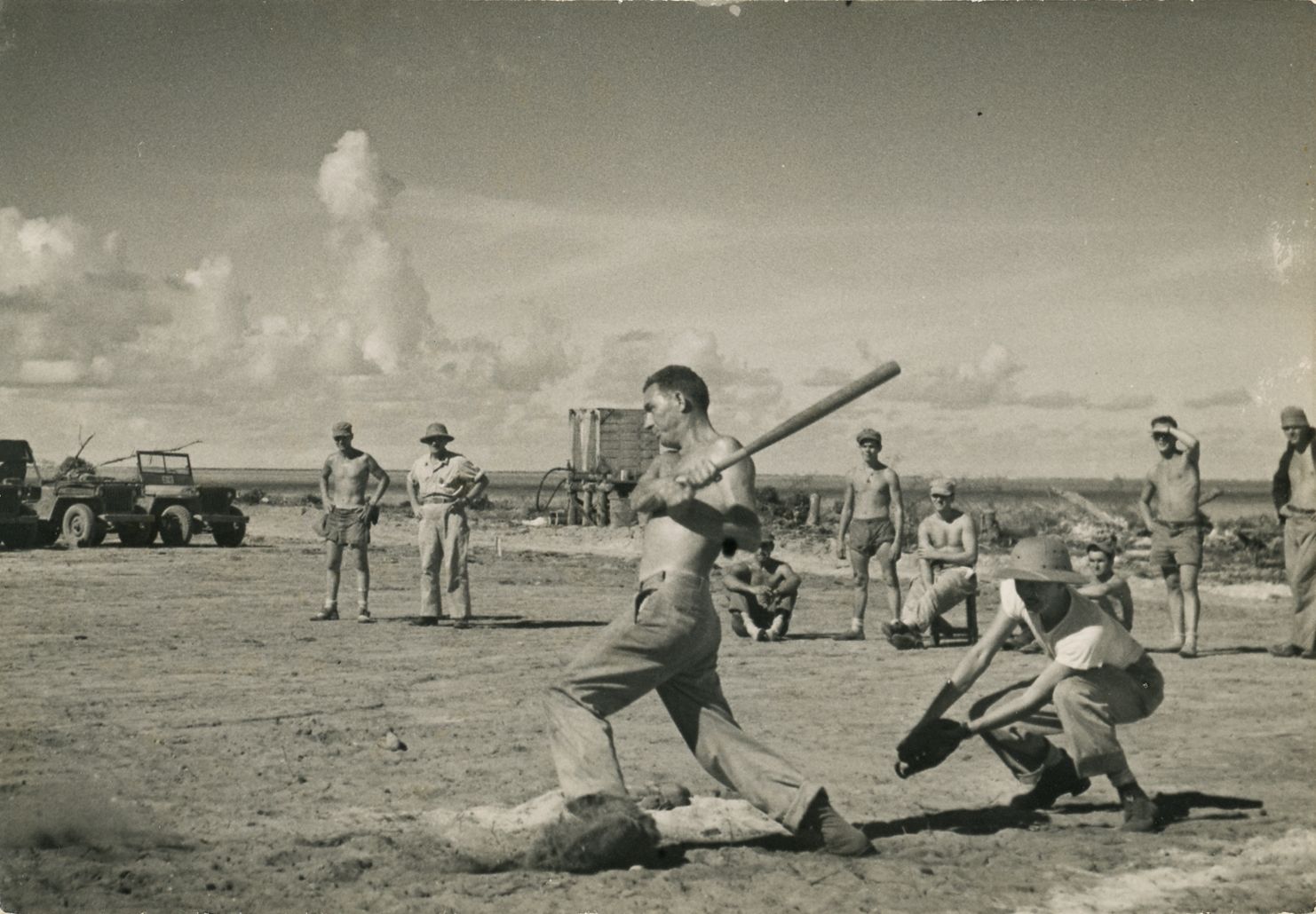 Black and white photograph of members of the 78th Seabees playing baseball on Ponam Island in 1944, with "Rube" Daniels striking out.