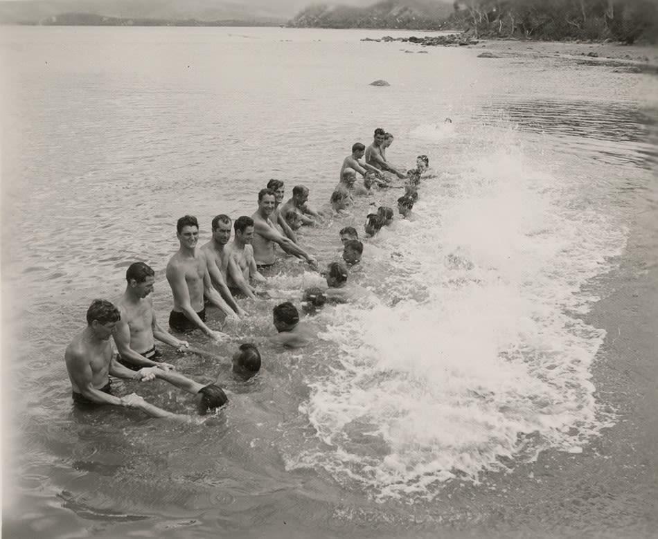 Black and white photogrpah of men of the 78th Seabees taking a swimming class, New Caledonia, 1945.