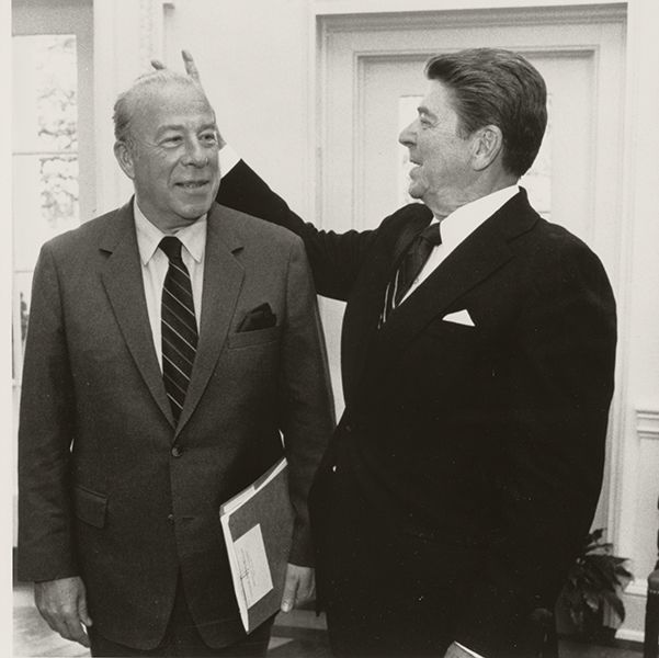 Black and white photograph of George Shultz and Ronald Reagan having fun together in the White House, 1980s From the George Pratt Shultz Papers, Hoover Institution Archives