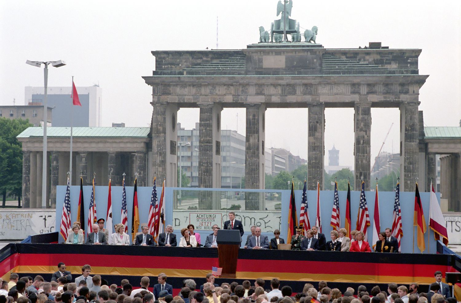 Color photograph of President Ronald Reagan, speaking in front of the Berlin Wall, declares: “Mr. Gorbachev, tear down this wall!” June 12, 1987. Courtesy Ronald Reagan Library